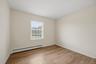 Comfortable secondary bedroom space with the flexibility for family, guests, or a home office.