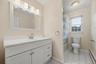 The full hall bath carries the home’s updated feel upstairs with a fresh vanity and bright finishes.