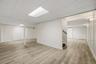 The lower level dramatically expands the home’s usable footprint, with multiple areas ready to take on a new purpose.