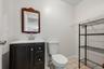 Tucked just off the kitchen, the main-level half bath adds everyday convenience without interrupting the home’s flow.