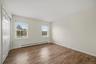 Two exposures bring natural light into this generously sized fourth bedroom.
