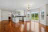 The kitchen opens directly into the dining area, with easy access to the deck and backyard beyond.