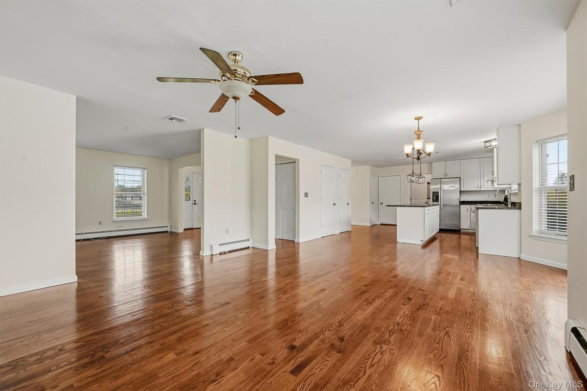 The main level flows effortlessly from one space to the next, with hardwood floors tying everything together.