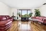 Wood flooring, framed window with natural light, and ample wall space
