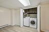 The laundry has its place, neatly tucked away while remaining easily accessible.