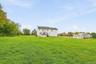 And then there’s the yard—an impressive stretch of open green space that gives the property its unmistakable sense of openness.