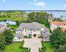 Exterior Aerial View- 6113 Grosvenor. Situated on oversized conservation 4.49 ACRE lot with 133 feet of Lake Tibet frontage.