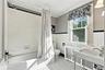 Classic black & white tiling and pedestal sink.