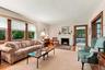 Spacious Living Room with beautiful wood-burning fireplace.
