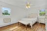 Substantially sized primary bedroom with great natural light and ceiling fan