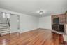 Huge family room with bricked platform for woodburning stove