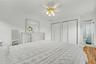 Substantially sized primary bedroom with his and hers closets