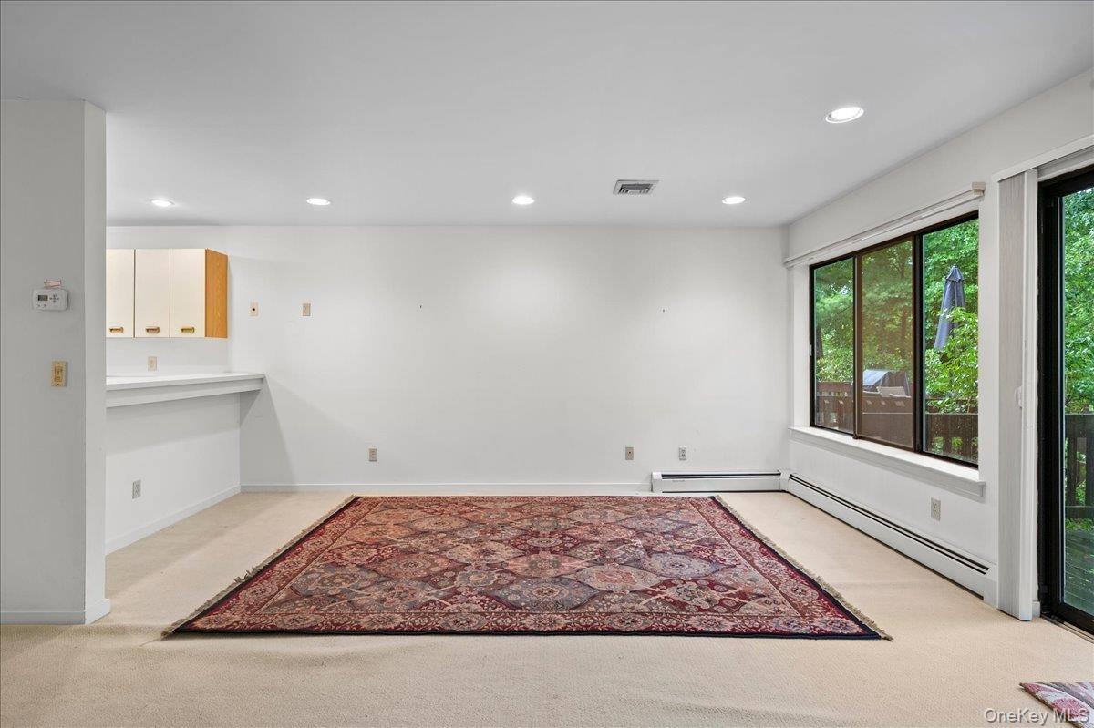 View of the large open living room with wall to wall windows