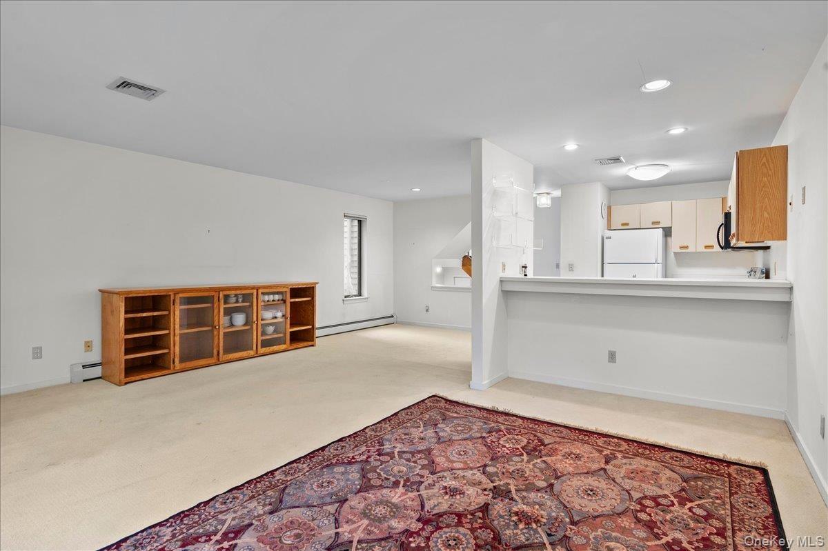 View of the living room open to the kitchen and dining area