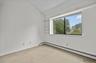 View from wall-to-wall closet in the bedroom.