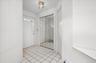 View that looks onto the front door and first floor half bath