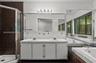 Double vanity, spa tub, and walk in shower
