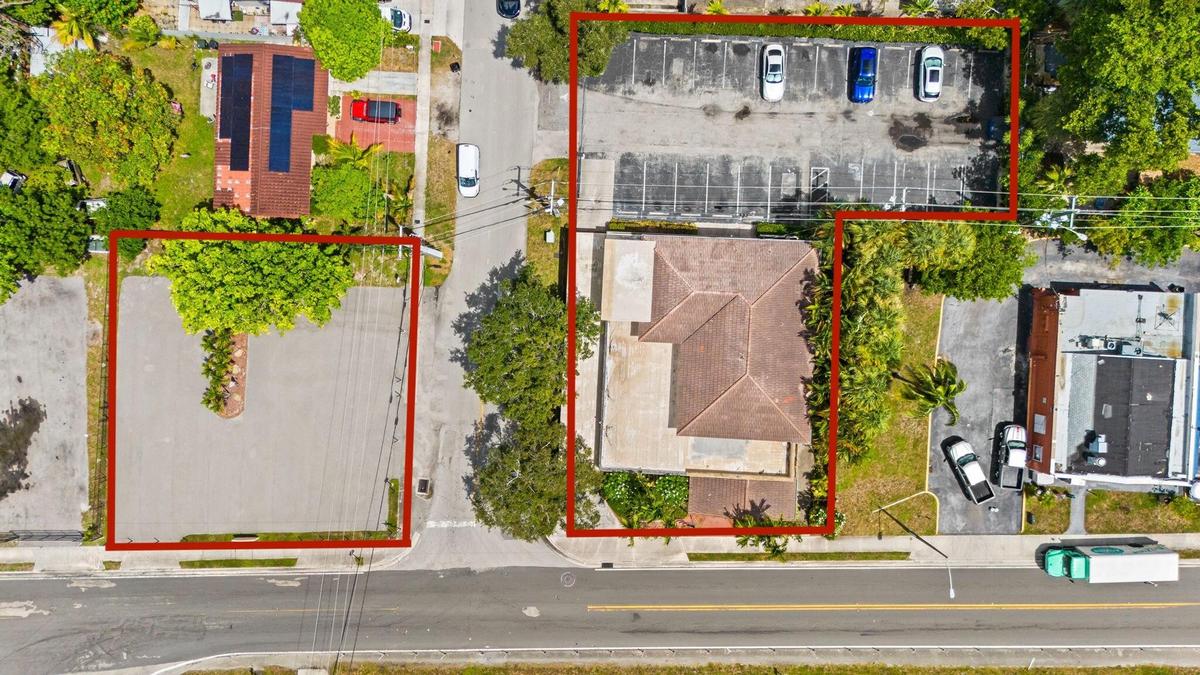 Aerial perspective highlighting land and building with parking