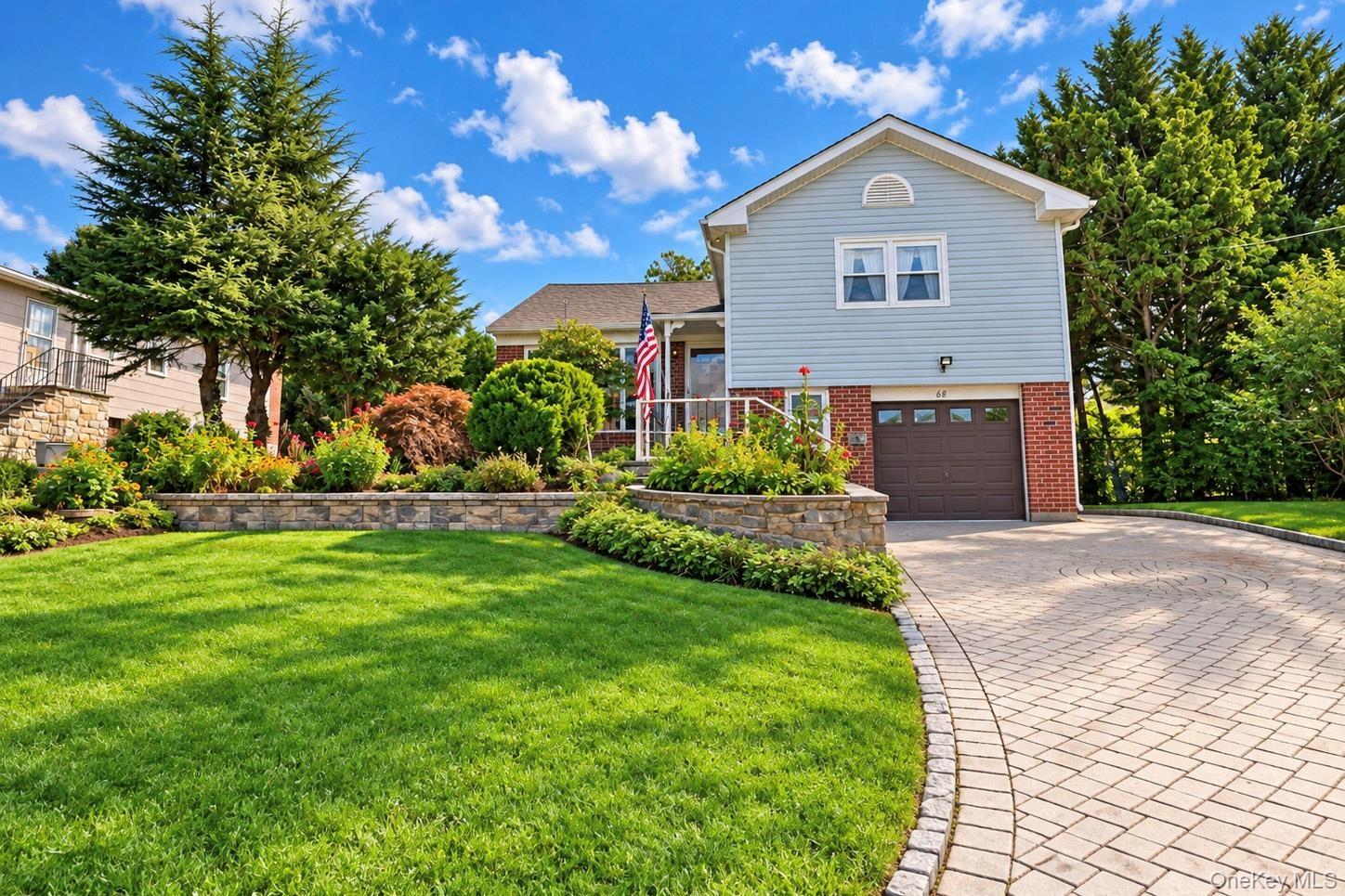 Light blue siding with brick accents