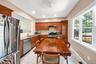 Large eat-in kitchen with hardwood cabinets, granite counter tops and stainless steel appliances