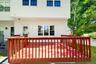Large wooden deck off the kitchen where you can grill and dine al fresco