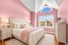 Third bedroom with high ceilings and hardwood floors