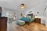 The Primary Suite features sliders to the lania, a large walk-in closet and beautifully appointed bathroom.