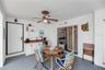 The back porch just off the primary suite has a build-in storage closet for pool toys and outdoor cushions and a serving station with sink and refrige