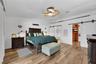 The cathedral ceiling and dual sliding barn doors give a charming vibe.