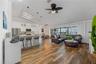 Open-concept floor plan where 12-foot sliding glass doors open to the expansive outdoor living area and beautiful waterfront views.