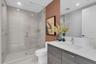 Guest ensuite bath with glass shower.