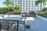 Resort pool deck with luxury lounge seating.
