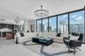 Elevated living area featuring floor-to-ceiling glass.