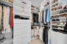Custom walk-in closet with built-in shelving.