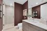 Stylish full guest bath with glass shower.