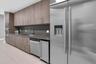 Event room kitchen outfitted for catering preparation with outdoor grill and seating