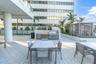 Relaxing poolside seating on private amenity deck.