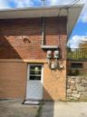 Property entrance with brick siding-Apartment