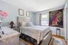 Bedroom featuring wood finished floors and baseboards