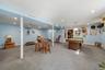 Finished lower level with recessed lighting, carpet flooring, and a ceiling fan
