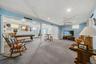 Spacious finished basement with recessed lighting, ceiling fan, and carpeted flooring
