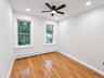 Hardwood flooring, recessed lighting, and a ceiling fan