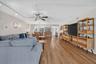 Wood-finish flooring extends throughout the open living area