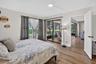 Wood-finish flooring throughout, sliding glass doors to a screened outdoor area