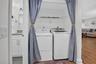 Dedicated laundry area with full-sized washer and dryer