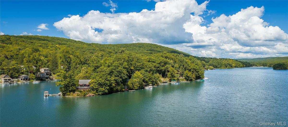 Set on a 4½-acre island with 16 individually owned cottage sites, this remarkable destination is accessible only by boat, creating an extraordinary se