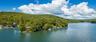 Set on a 4½-acre island with 16 individually owned cottage sites, this remarkable destination is accessible only by boat, creating an extraordinary se