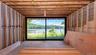 Designed to include a large family room with sliding glass doors opening directly to the front deck, surrounding yard and waterfront.