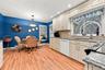 Kitchen leads you out to Sunroom and Patio for grilling.