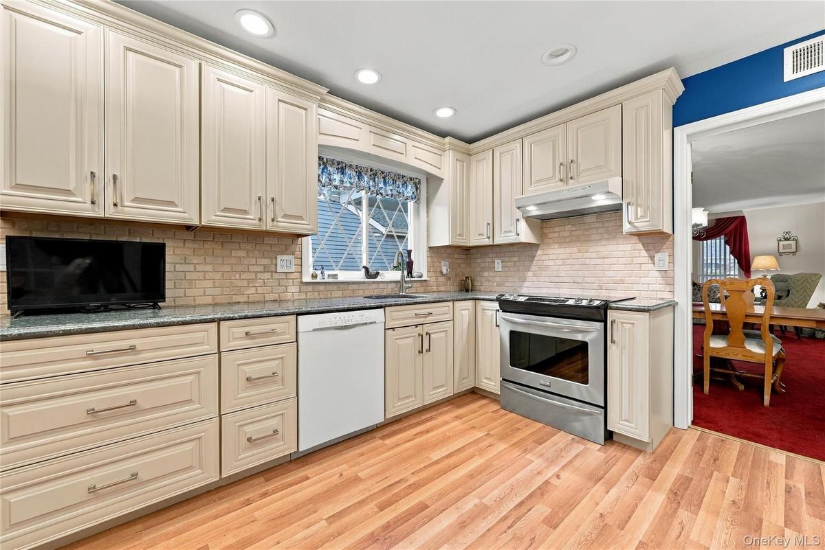 Custom Kitchen w/ stainless Range and Granite counters